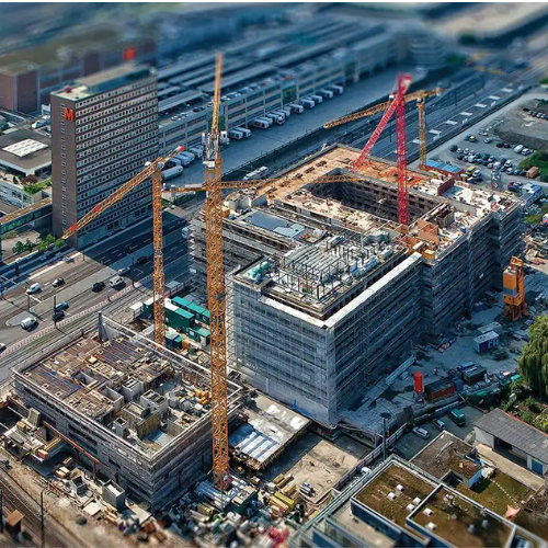 Modern construction site with cranes and high-rise buildings showcasing the Future of Infrastructure in India.